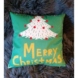 Párnahuzat zöld anyagból, "Merry Christmas" felirattal és fehér fenyőfa mintával